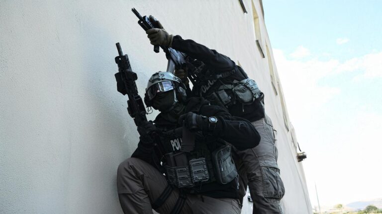 Armed federal agents in tactical gear