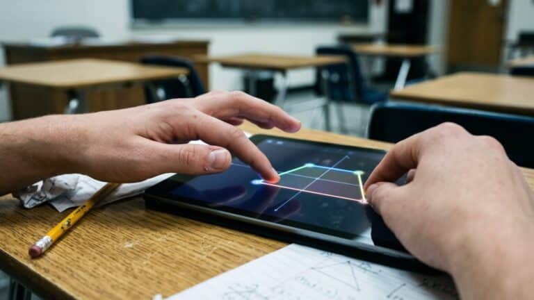 Student hands interacting with Khanmigo Gemini interactive diagram on a tablet, google org