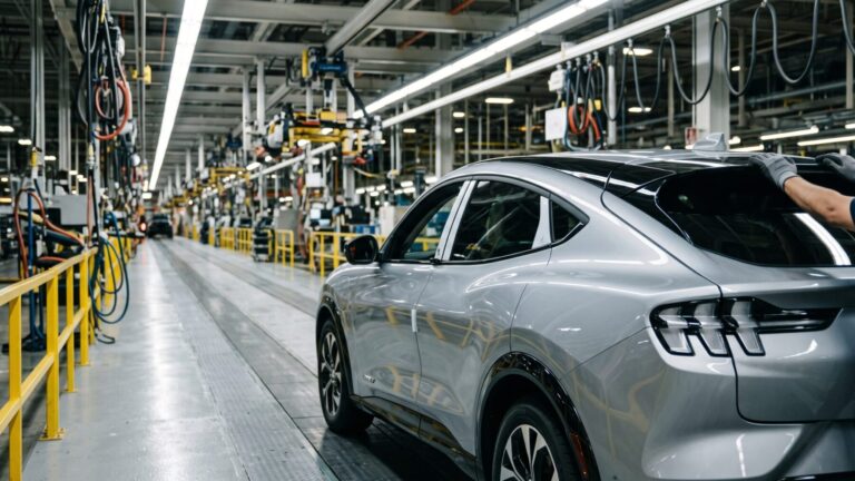 Worker's hands on a sleek in-house electric SUV on an Ohio assembly line, ohio plant