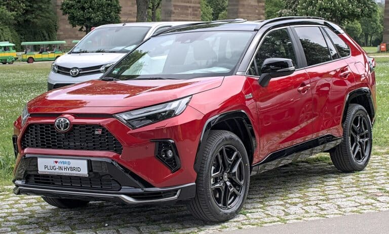 Hybrid SUV at a dealership lot illustrating a US sales record, 585 000