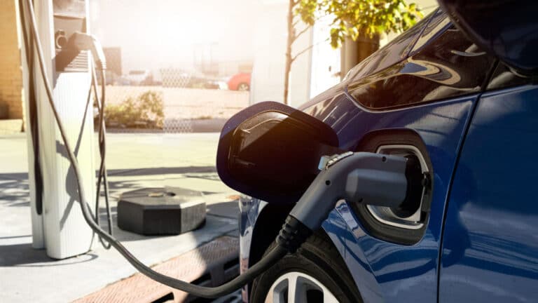 Residential EV charger plugged in overnight illustrating managed charging off-peak grid load