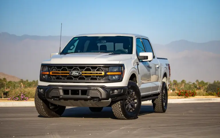 Undercarriage view of F-150 fuel tank mounting strap during recall inspection, ford recalls