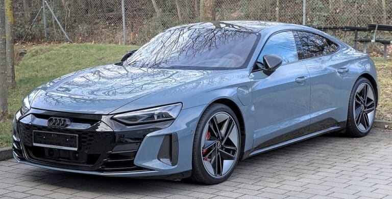 Electric sedan on dealer lot showing Audi incentive discount, audi offers