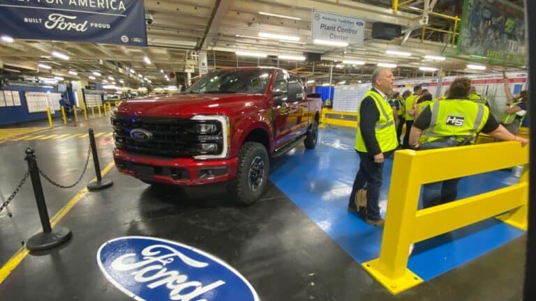 Pickup truck chassis on assembly line reflecting Ford Q3 sales, ford holds