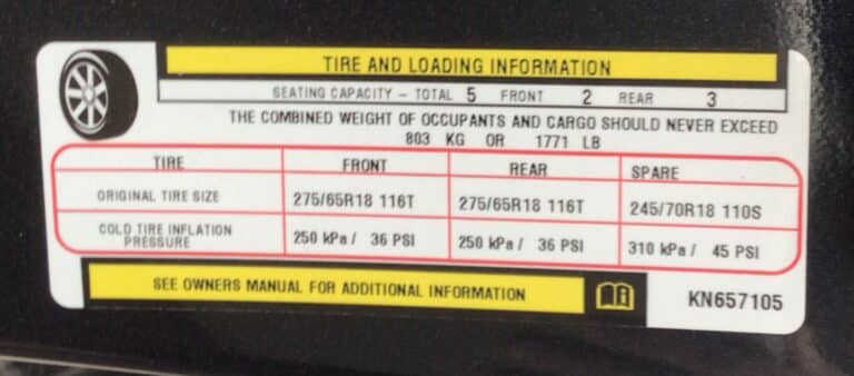 Door jamb sticker showing a pickup truck's real payload limit, half ton