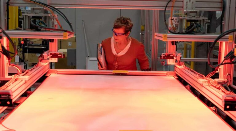Hands loading silicon wafers into HJT cell production line, hjt cell capacity