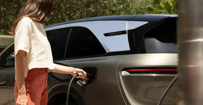 Charging cable plugged into EV during 400 kilowatt charging test, lucid suv