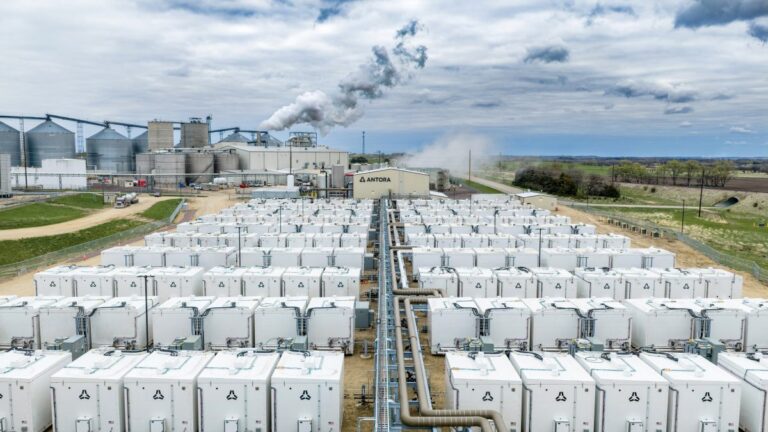 Rows of iron-air battery storage containers in a Minnesota field, minnesota battery