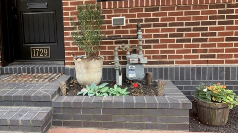 Gas meter on a house tied to rising customer charge
