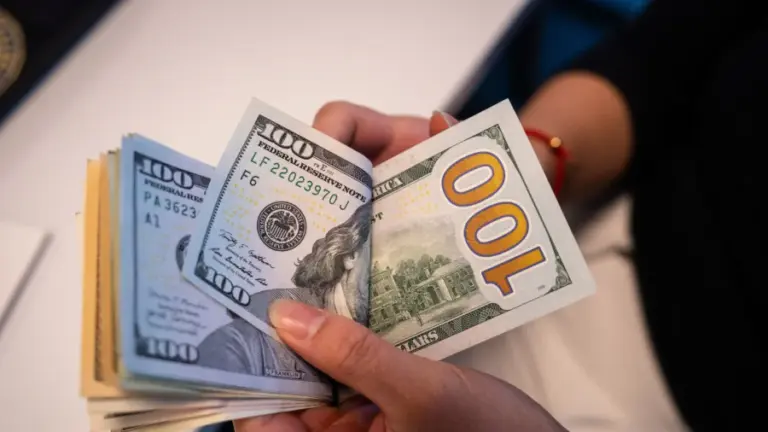 Receipt and cash on a restaurant table reflecting average date cost, single dinner