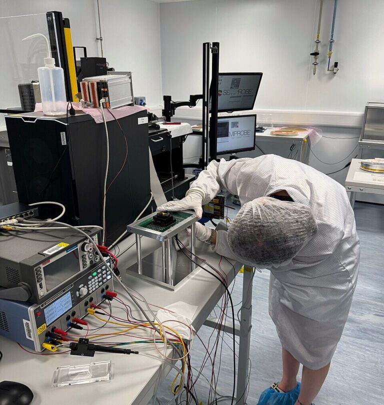 Technician handling a photomask set used in chip fabrication, single stack